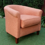Tub Chair reupholstered in fabric Noosa colour Melon by Warwick Fabrics